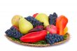 Fruits , pepper and parsley leaves on a plate on a white backgro