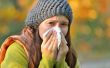 girl with allergy or cold using tissue