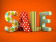 Sale word colorfull fabric on grey background