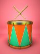 Drum and drumsticks on pink background