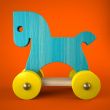 Blue wood horse toy on red background