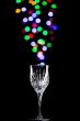Light bubbles coming out of a wine glass