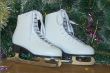 New year`s gift - the beautiful woman skates.