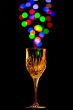 Light bubbles coming out of a wine glass