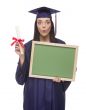 Female Graduate in Cap and Gown Holding Diploma,Blank Chalkboar