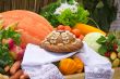 Beautiful cake on a white towel, vegetables, fruits.