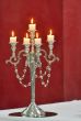 Silver classic candlestick isolated on red