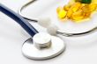 Stethoscope and a lot of colorful pills.