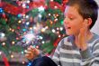 portrait of boy looking at  fire sparks