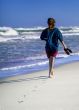 Caribbean Cuba woman goes for a walk on the beach in the Caribbean