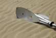 Kayak paddles laying in the sand