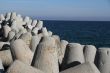 Breakwaters on the boat station. Large gray breakwaters installed at the seaport to reduce the waves.