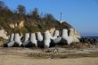 Breakwaters on the boat station. Large gray breakwaters installed at the seaport to reduce the waves.