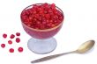 Viburnum berries in syrup on a white background.