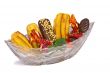 Cakes and sweets in a crystal vase on a white background