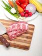 chopping fresh pork ribs and vegetables