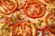 pizza with red tomato circles 
