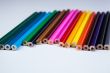 a stack of colored pencils