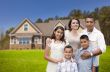 Young Hispanic Family in Front of Their New Home