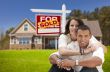 Hispanic Couple, New Home and Sold Real Estate Sign