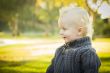 Adorable Blonde Baby Boy Outdoors at the Park