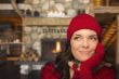 Mixed Race Girl Enjoying Warm Fireplace In Rustic Cabin