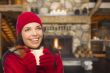 Mixed Race Girl Enjoying Warm Fireplace and Holding Mug