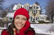 Smiling Mixed Race Woman in Winter Clothing Outside in Snow