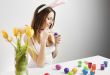Girl painting easter eggs