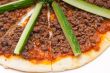 Turkish beef pizza with cucumber on top