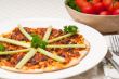Turkish beef pizza with cucumber on top