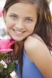 Pretty Young Girl Holding Flower Bouquet at the Market