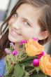 Pretty Young Girl Holding Flower Bouquet at the Market