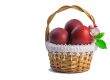 Red Easter eggs in a basket on a white background.