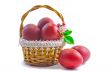 Red Easter eggs in a basket on a white background.