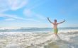 boy playing in waves