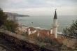 Tower of ancient castle on the sea background