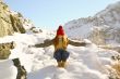 Young girl goes down with a snow mountain 