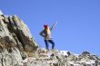 Young girl standing on a rock 