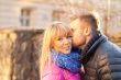 Young man kissing a beautiful woman