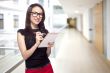 Girl in office with paper notepad