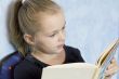 Cute girl reading a book