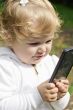 Cute infant with cellular
