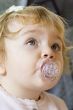 Cute infant with nipple