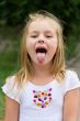 Cute girl with put out tongue