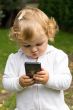 Cute infant with cellular