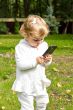 Cute infant with cellular