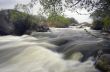 Threshold of the mountain river and wet stones 
