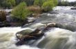 Threshold of the mountain river and wet stones 