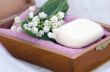 Spa setting of  towels, soap and lilies of the valley 